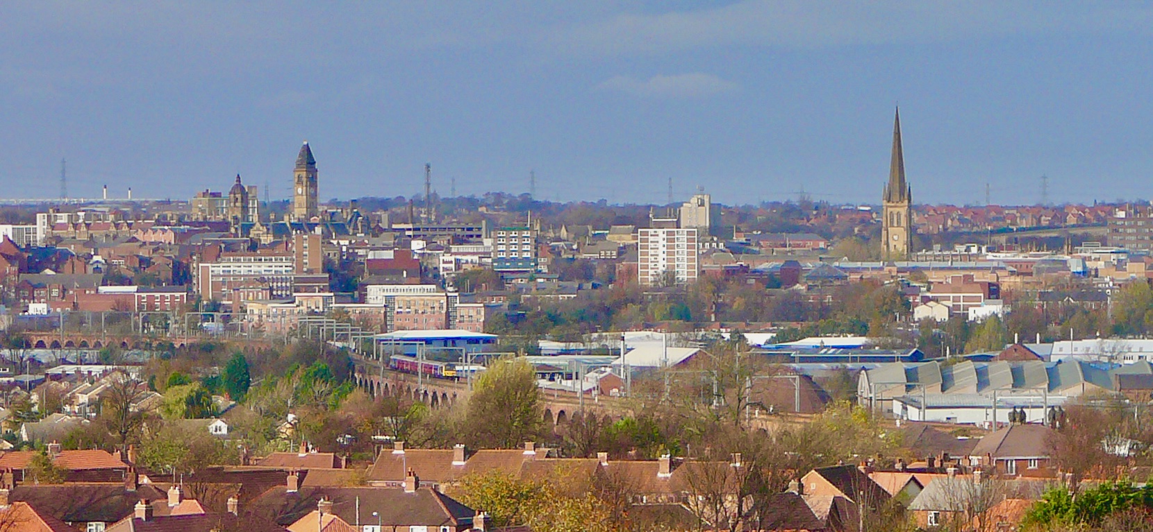 Wakefield view from The Sandal Castle. The towers of The Wakefield Cathedral and The Town Hall are visible.